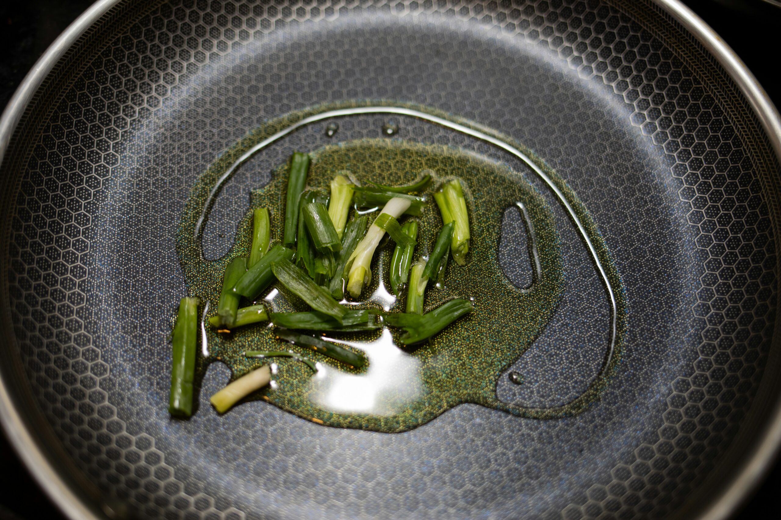 green vegetable on stainless steel round plate
